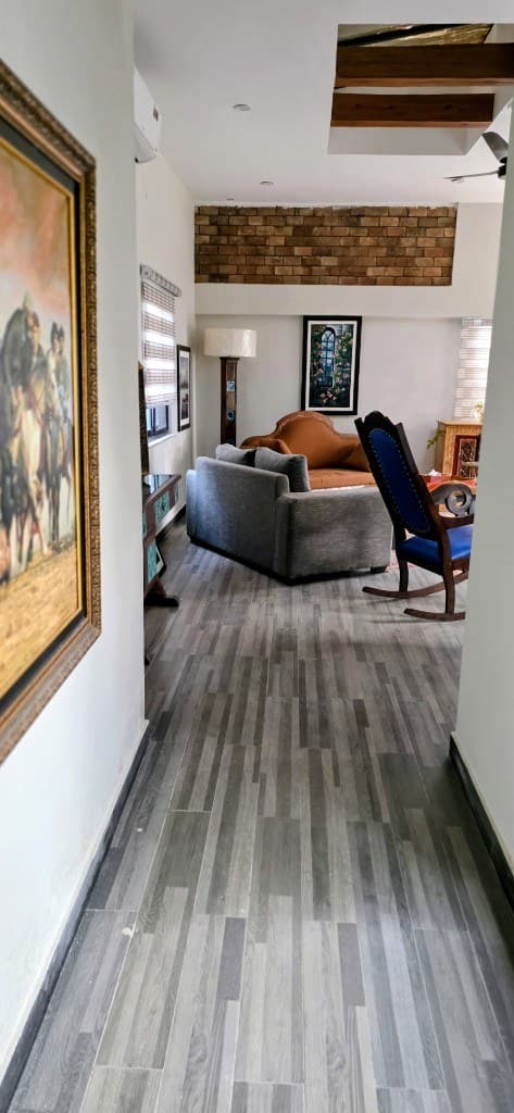 Elegantly furnished living room with traditional sofas at OliveHill Cottages