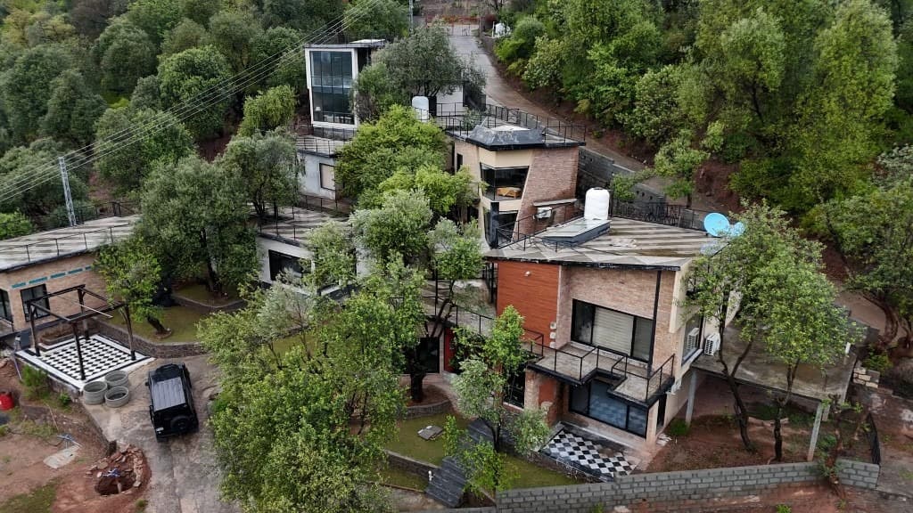 OliveHill Cottages compound glowing at night in the Murree mountains